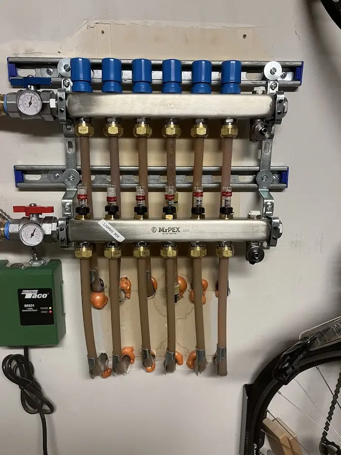 Plumber performing Water Heater Repair at a residential property in North Hampton